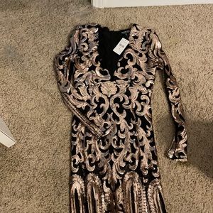 Black dress with beautiful Gold sequins. Running small size .